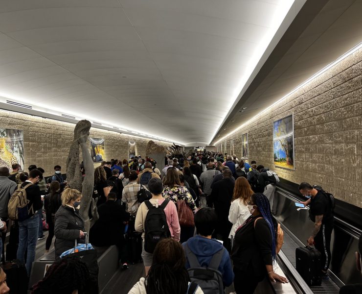 a group of people on an escalator