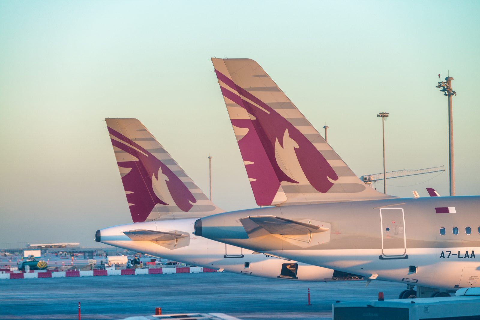 a group of airplanes parked on a runway