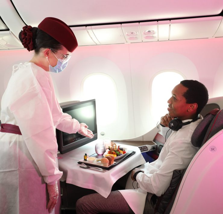 a woman in a white coat and a man in a white suit
