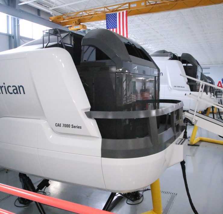 a group of helicopters in a hangar