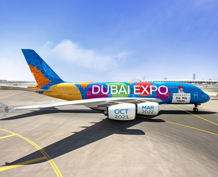 a colorful airplane on a runway