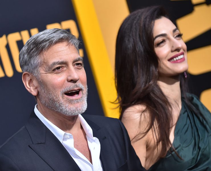 a man and woman standing next to each other