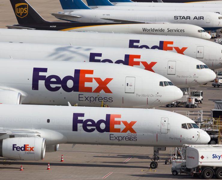 a group of airplanes parked on a tarmac