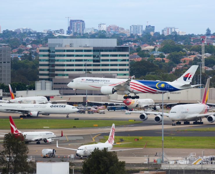a group of airplanes on a runway