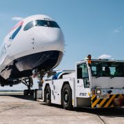 a plane being towed by a tow truck