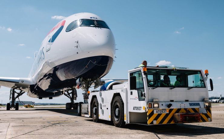 a plane being towed by a tow truck