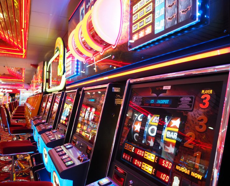 a row of slot machines in a casino