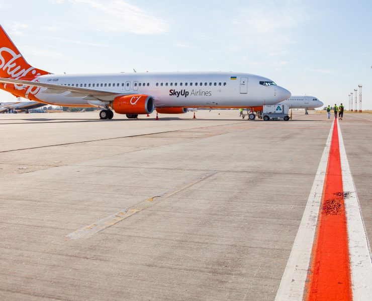 a two airplanes on a runway