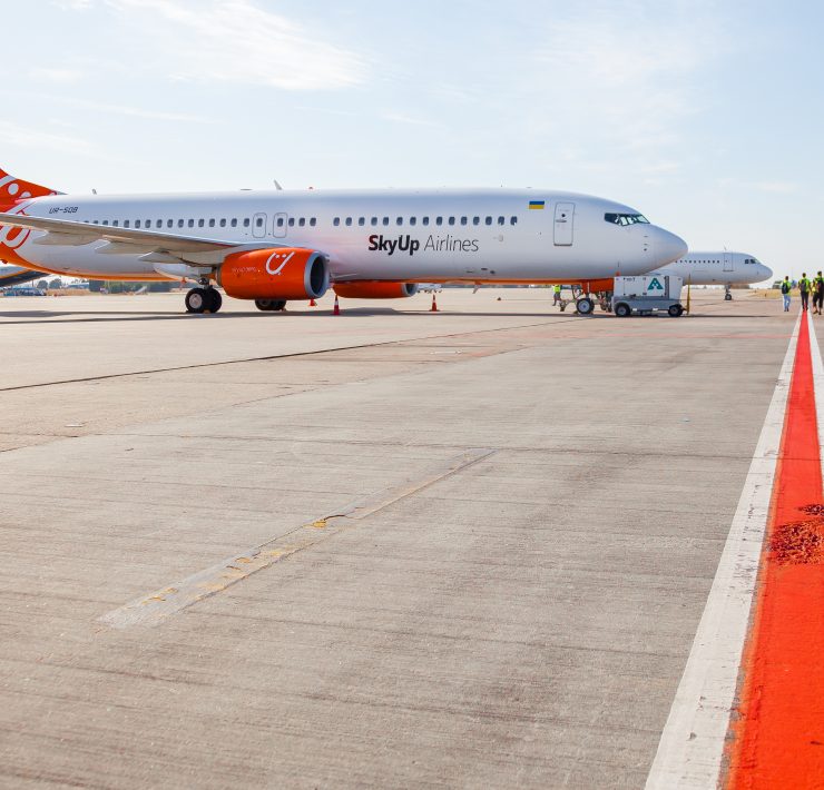 a two airplanes on a runway