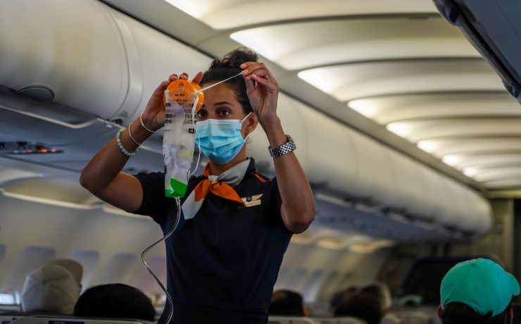 a woman wearing a mask and holding a medical mask
