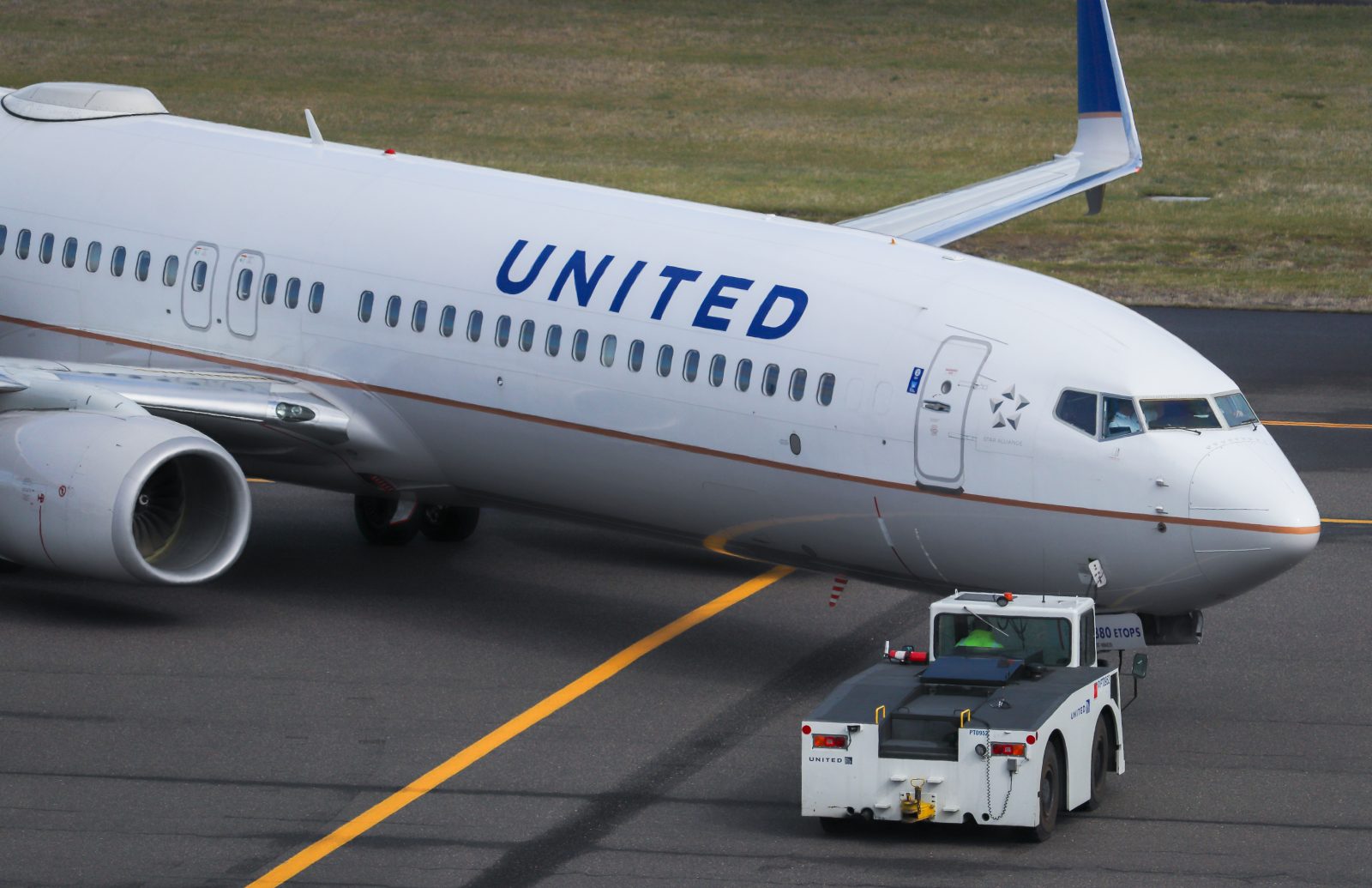 a white airplane on a runway