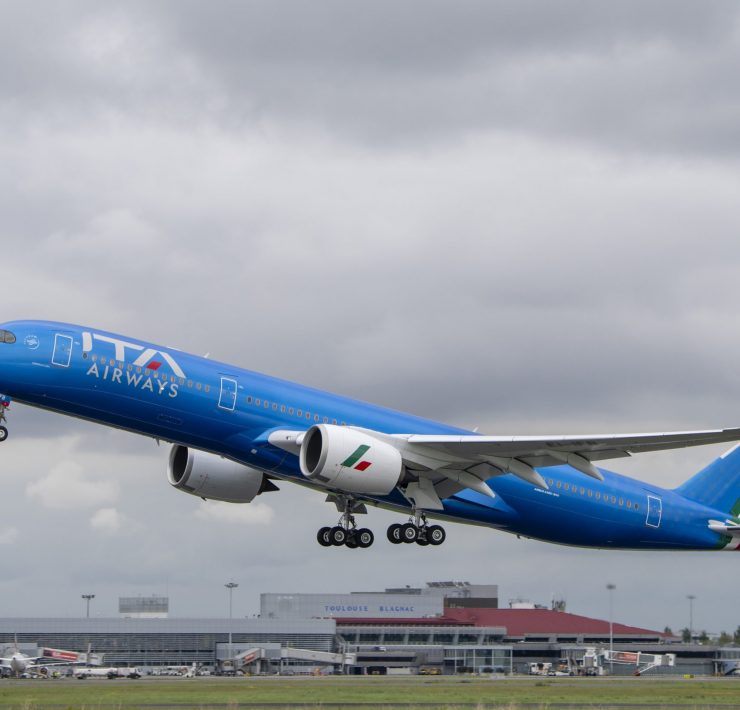 a blue airplane taking off