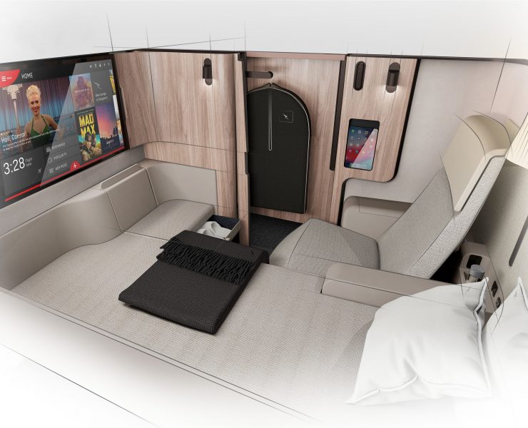 a bed with a screen on the wall