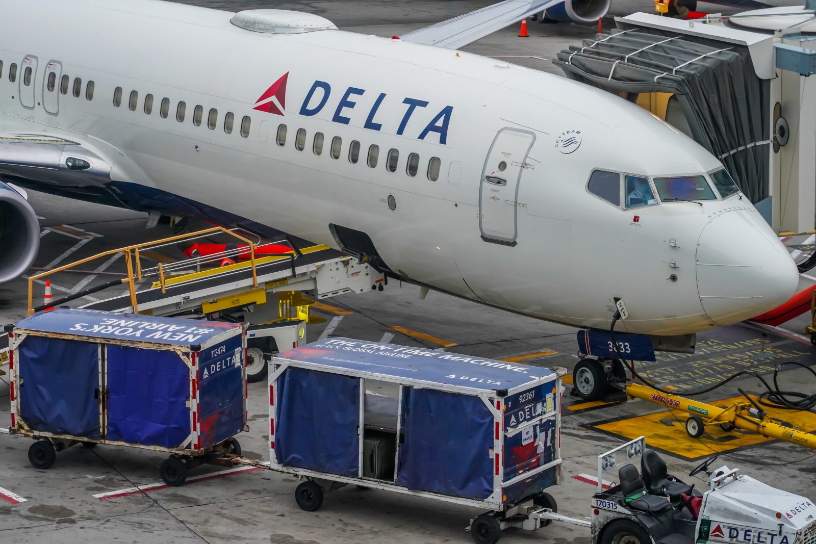 a white airplane with blue and white text on it