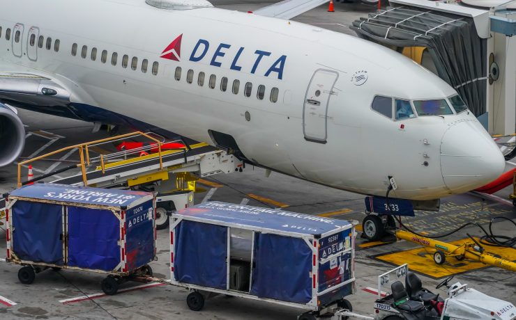 a white airplane with blue and white text on it