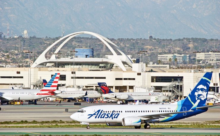 a group of airplanes on a runway