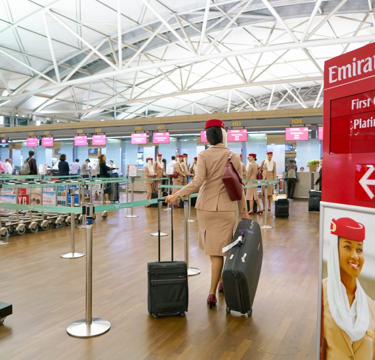 a woman with luggage in an airport