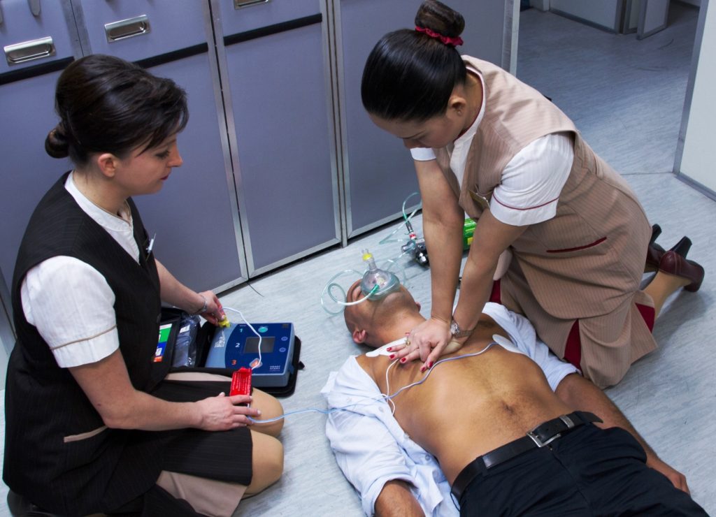 a group of people working on a patient