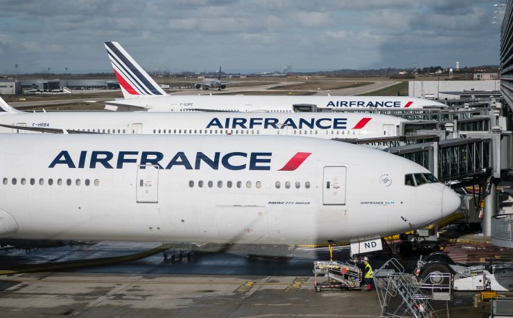 a group of airplanes at an airport