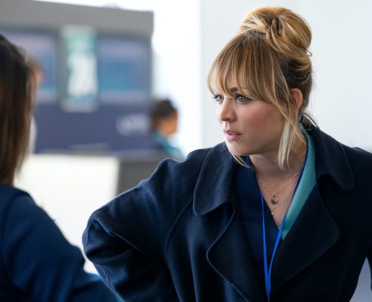 a woman in a blue coat