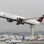 a large white airplane taking off