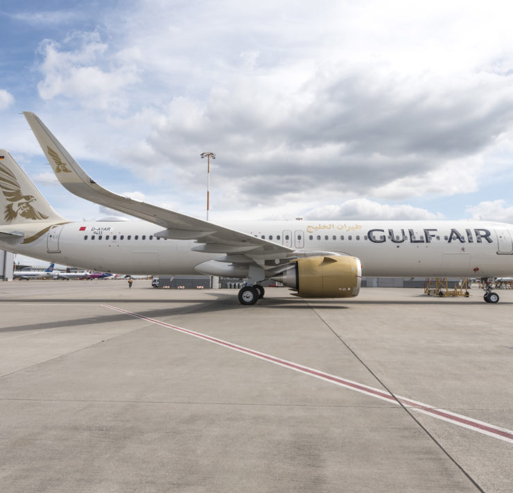 a large white airplane on a runway