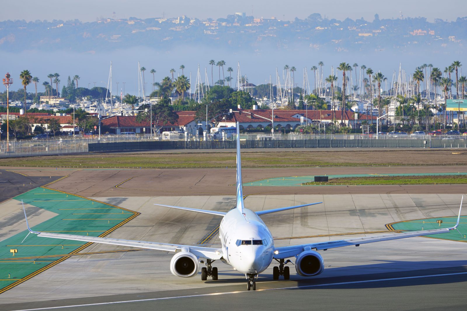 a white airplane on a runway