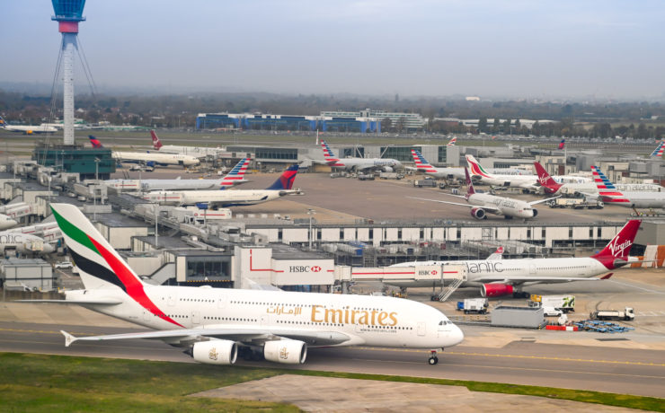a group of airplanes at an airport