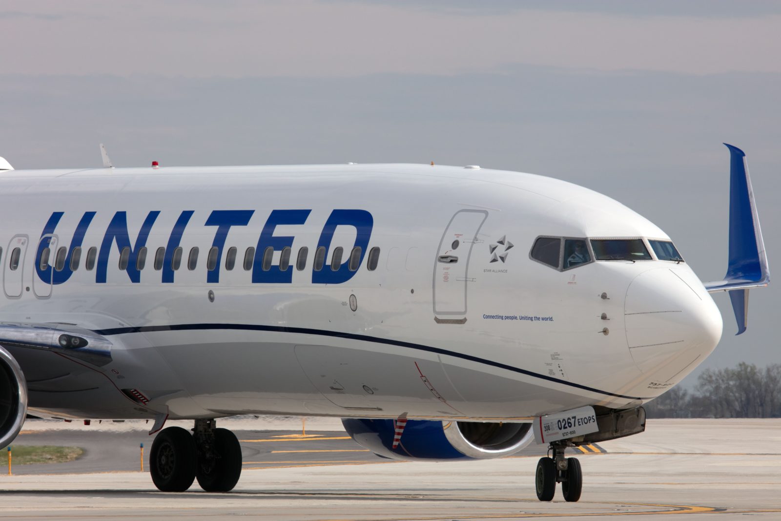 a white airplane on a runway