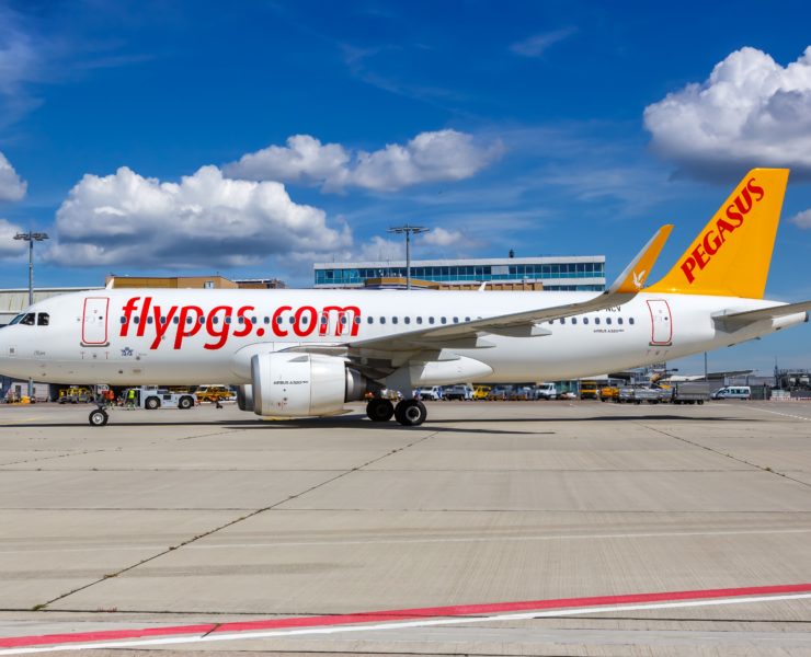 a white airplane on a runway