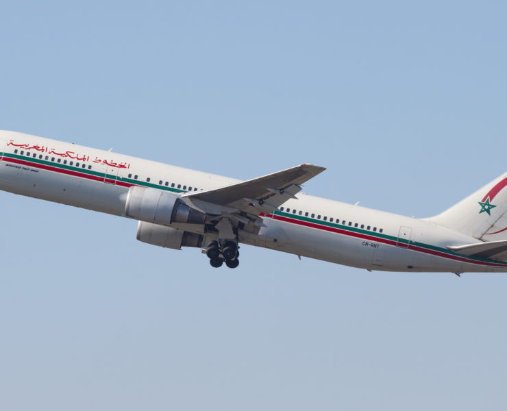 a white airplane flying in the sky