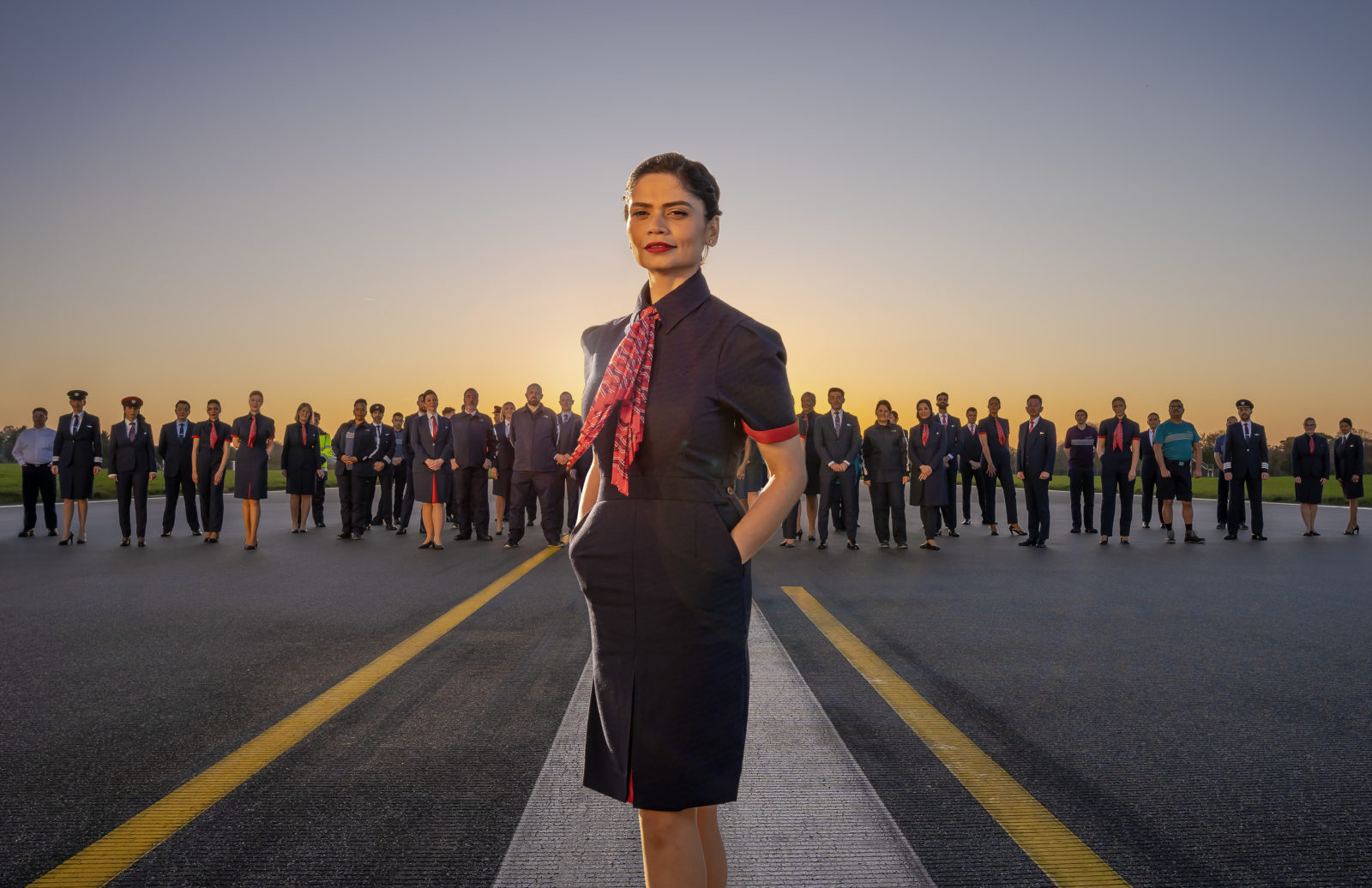 a woman standing in front of a group of people