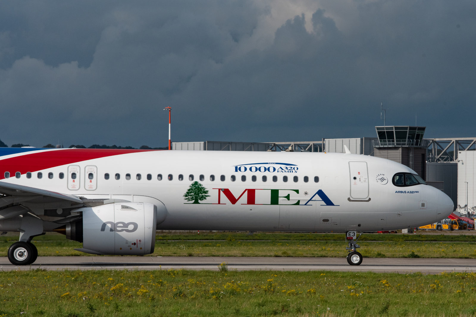 a white airplane on a runway