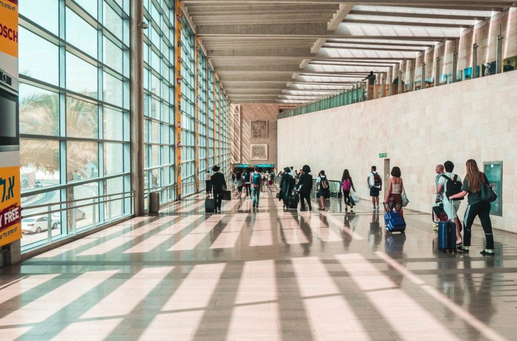 a group of people walking in a building