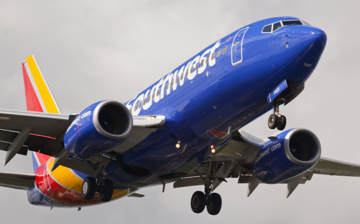 a blue airplane in the air