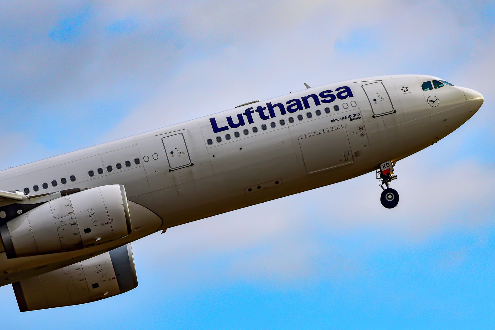 a large white airplane in the air