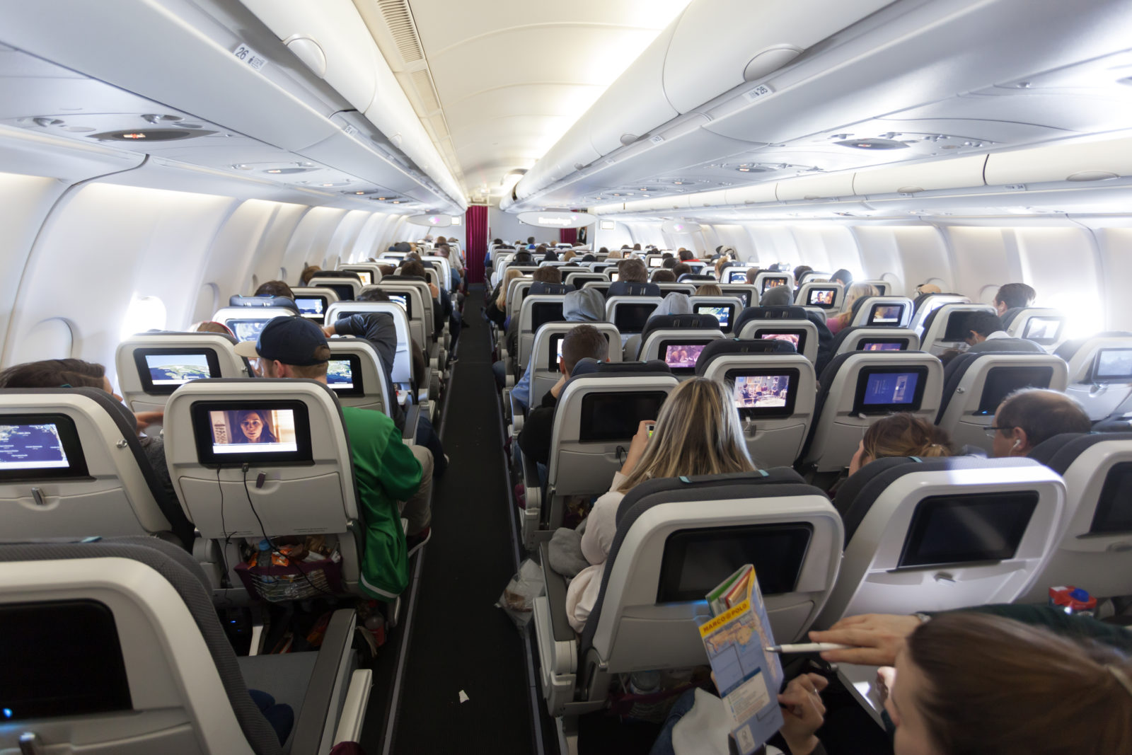 a group of people sitting in an airplane