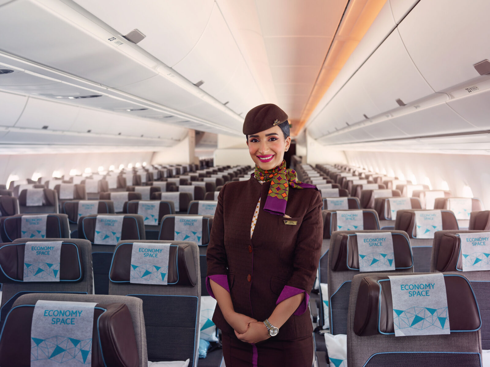 a woman in a uniform in an airplane