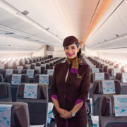 a woman in a uniform in an airplane
