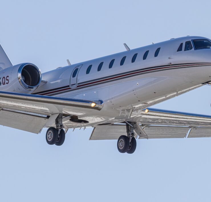 a white airplane in the sky