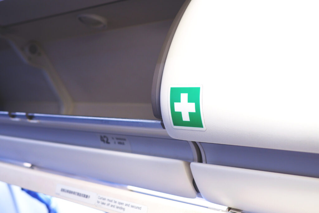 a green cross on a white object