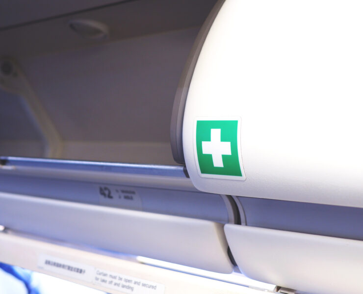 a green cross on a white object