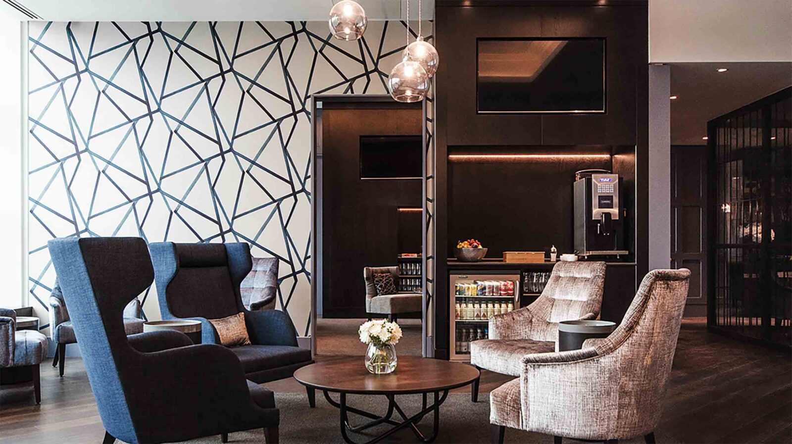 a room with chairs and a coffee table