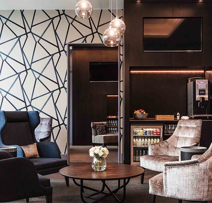 a room with chairs and a coffee table