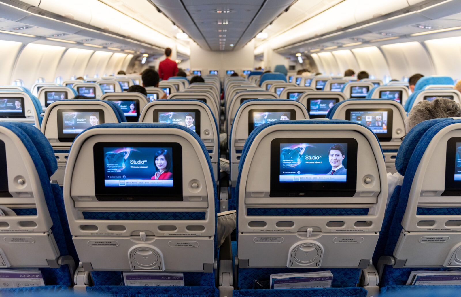 rows of seats with monitors on the back