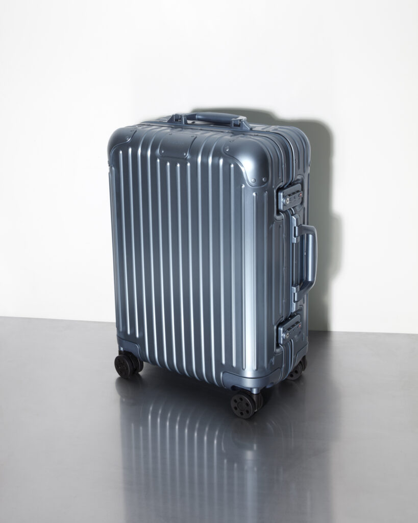 a silver suitcase with wheels