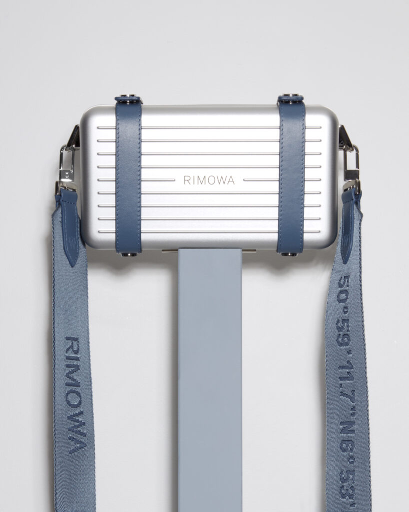 a silver rectangular object with straps
