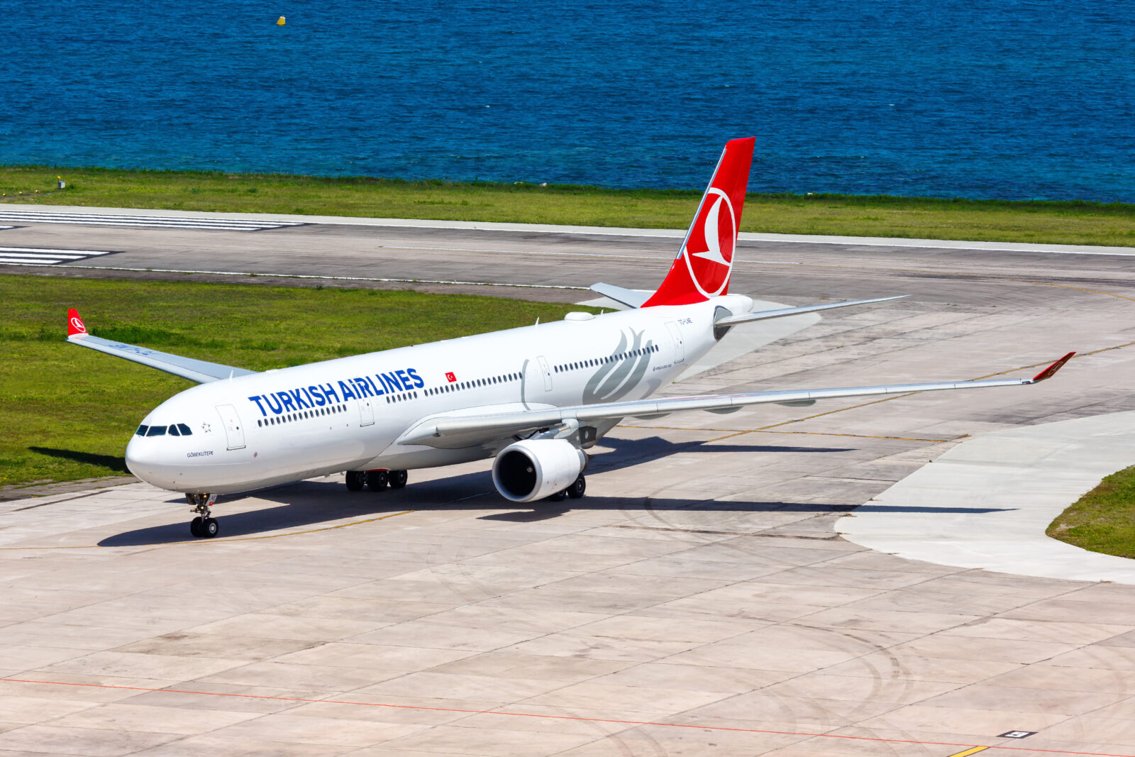 a white airplane on a runway