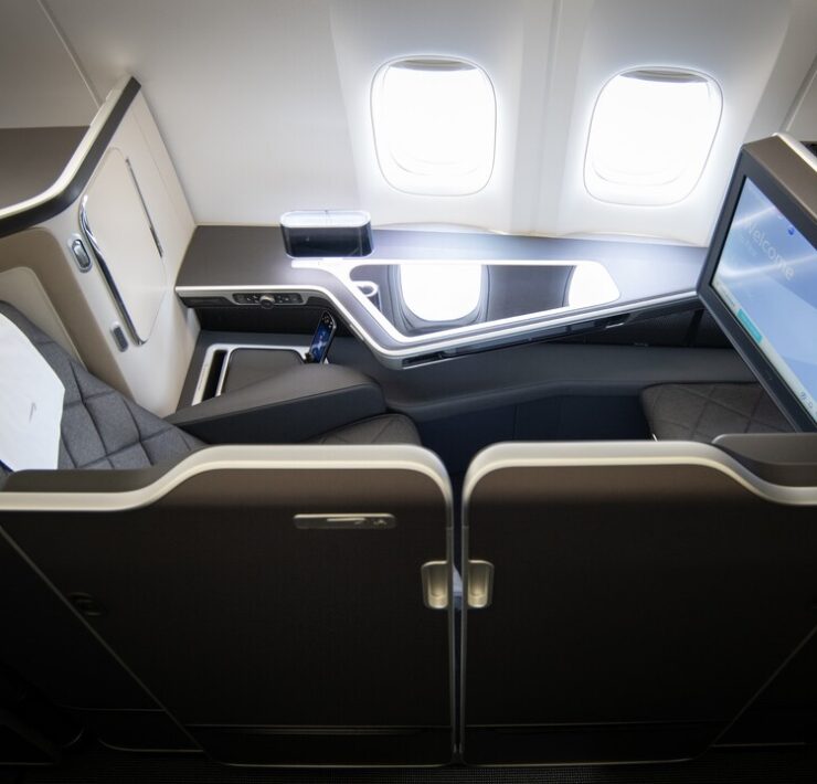 a seat with a monitor on the back of the seat