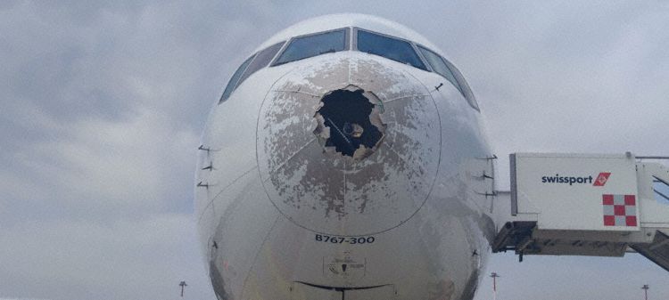 the front of an airplane with a hole in the nose